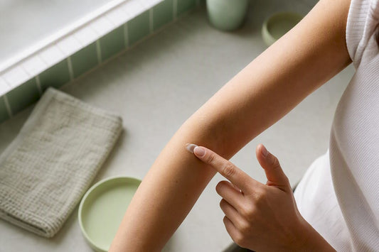 Person applying skincare patch test to arm