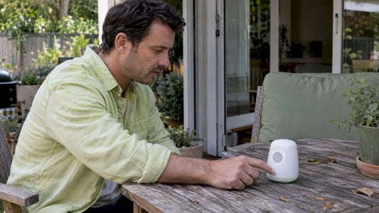 Hand switches on an ultrasonic mosquito repellent