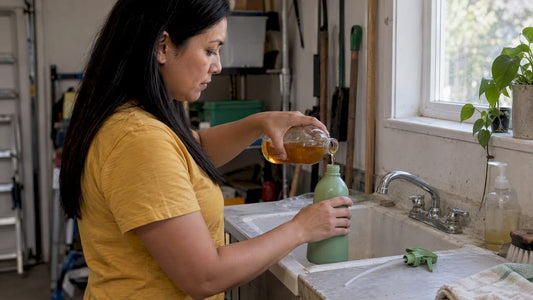 Mixing vinegar and water in spray bottle